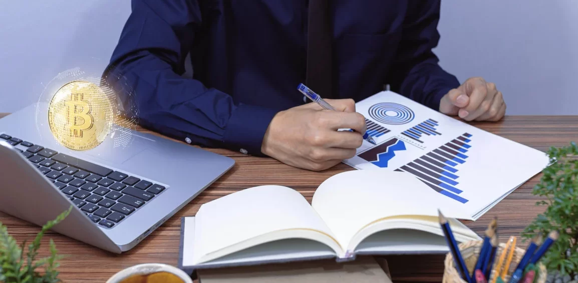 wood-man-model-hold-bitcoin-coin-near-1300x731 UK Non-Residency Tax Planning for Crypto Investors: How to Legally Reduce Your Tax Liability on Crypto Gains