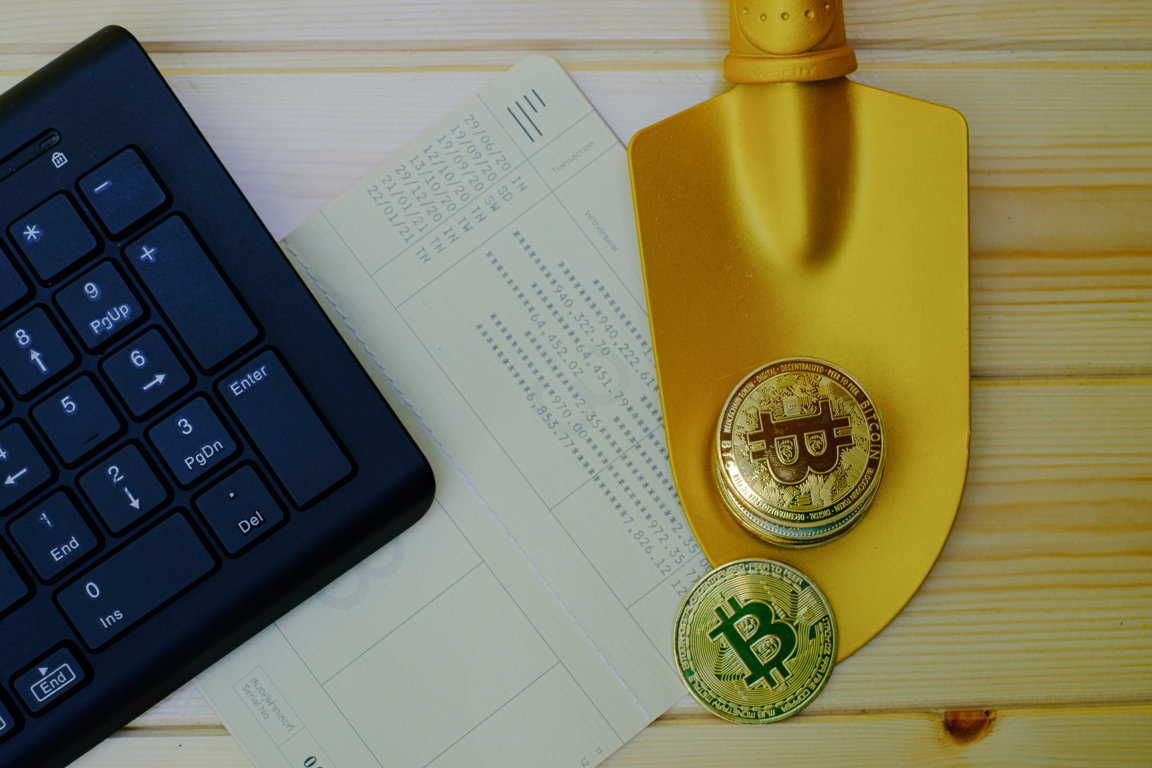 bitcoin-clock-with-calculator-other-objects-wooden-table-FILEminimizer Top Crypto Tax Compliance Service in the UK 2025 | MyCryptoTax 